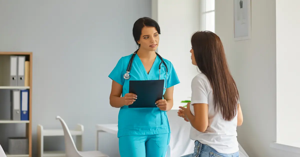 IVF fertility specialists consulting with a patient in a modern medical office setting.