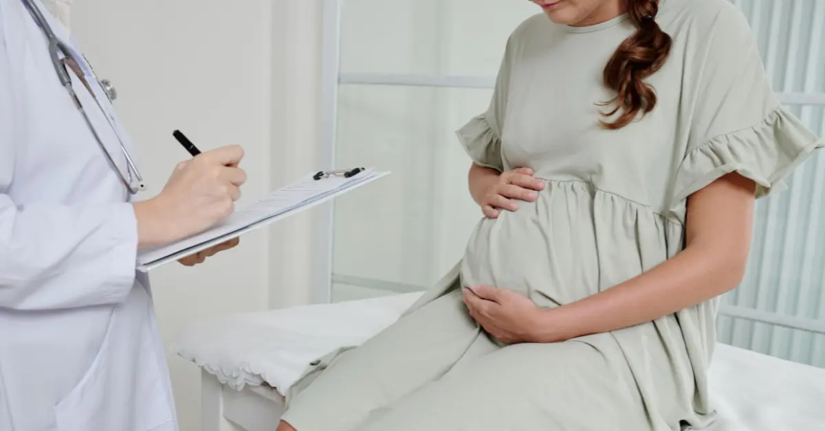 IVF procedure guidance as a doctor talks seriously with a woman during a fertility consultation.